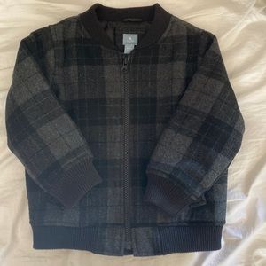 Grey/black plaid varsity jacket.